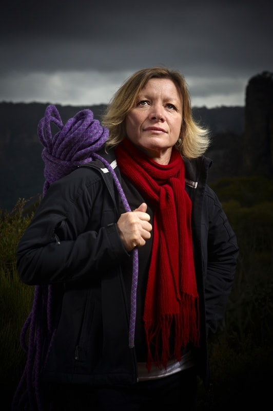 Female climber poses with a rope Women in non traditional occupations Rockclimbing